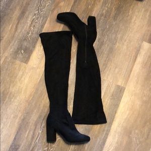 Carlos Santana’s over the knee black boots